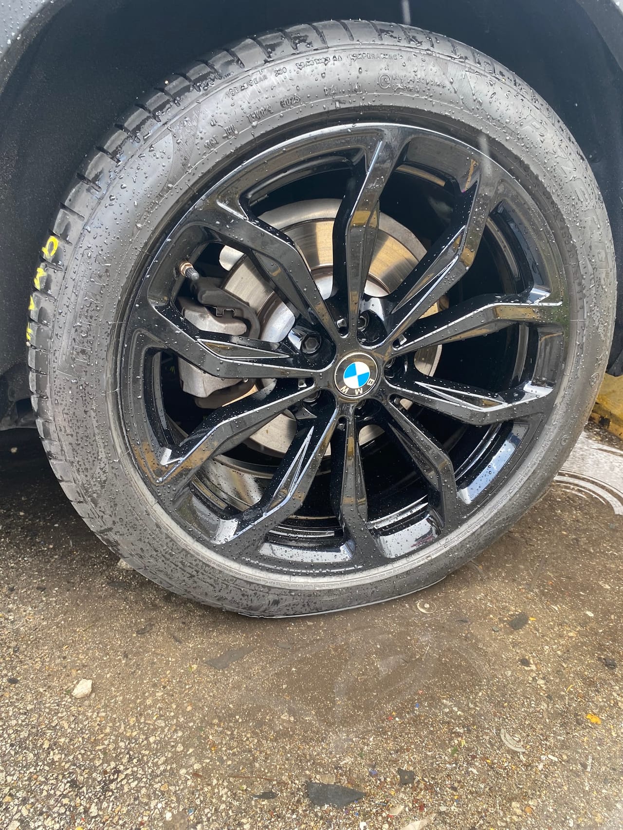 Gloss black BMW wheel after refinishing