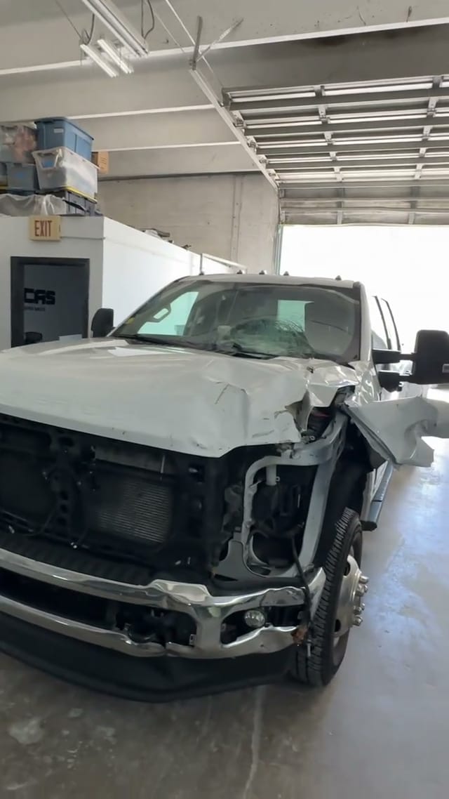 Ford F-350 Super Duty with the front end torn off after a collision